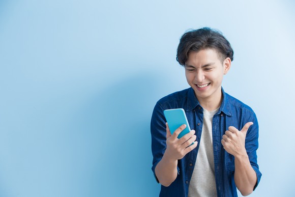 A man uses a smartphone.