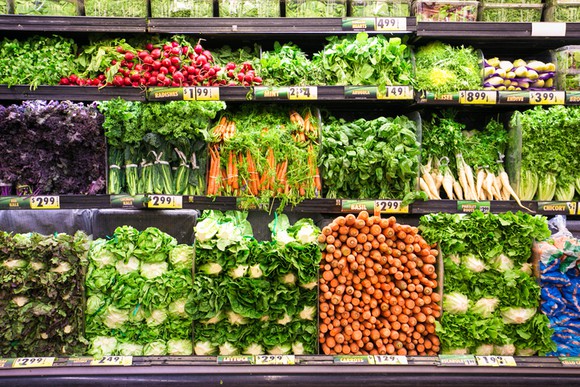 Colorful wall of grocery produce.