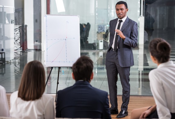 Manager giving a presentation to his team