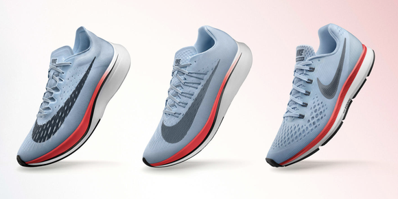 Three Nike Zoom Vaporfly 4% running shoes lined side by side.