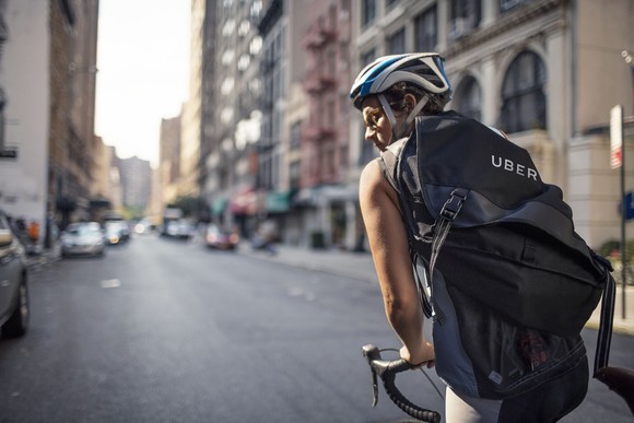 A cyclist with an Uber messenger bag