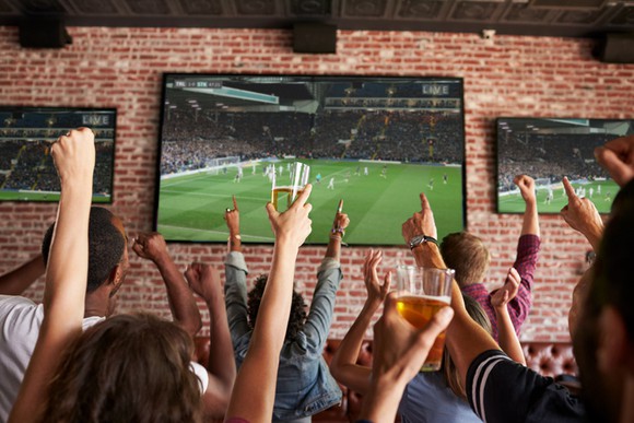 People watching sports on a TV.