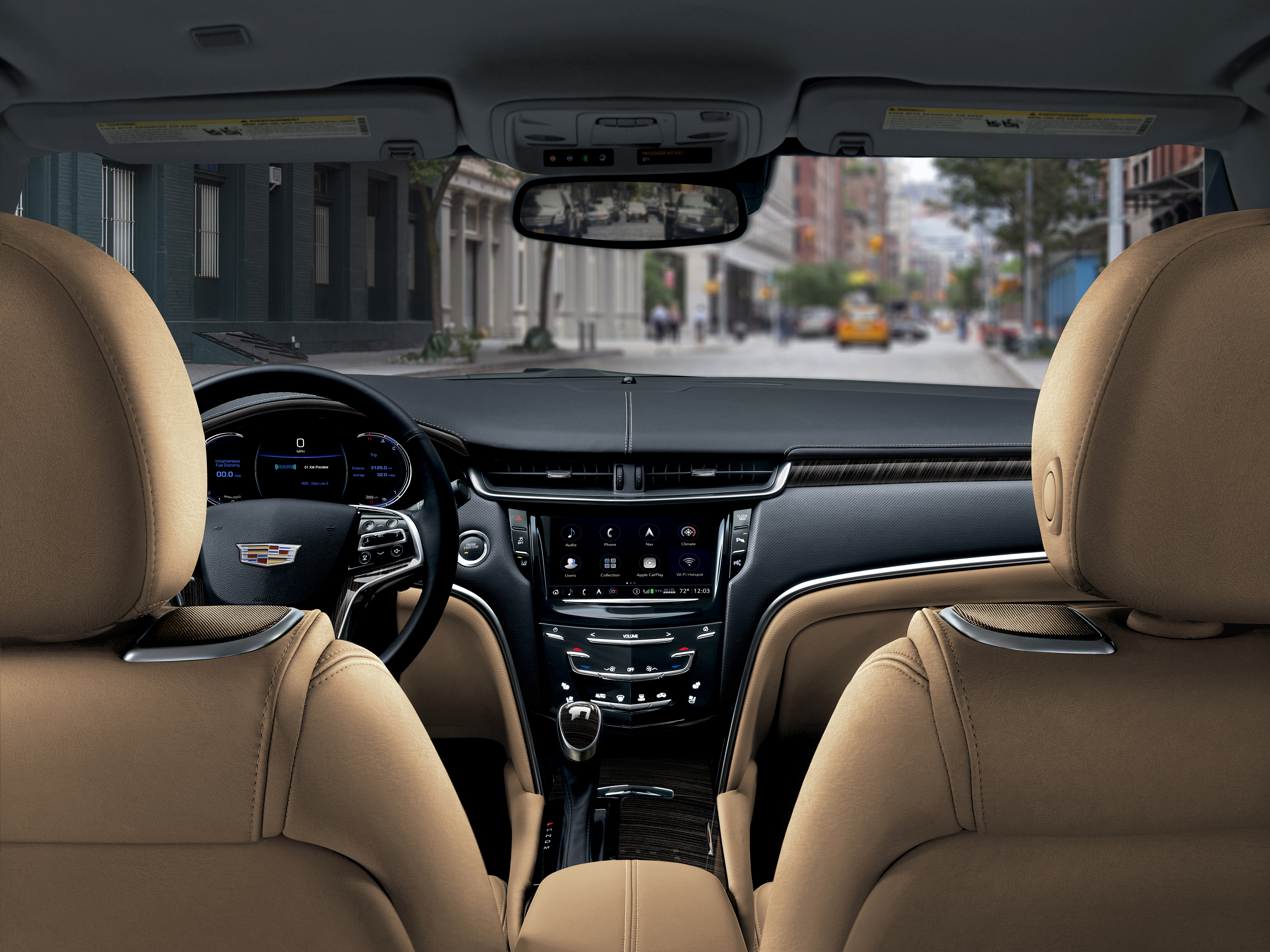 The 2018 Cadillac XTS's dash, viewed from the rear seat