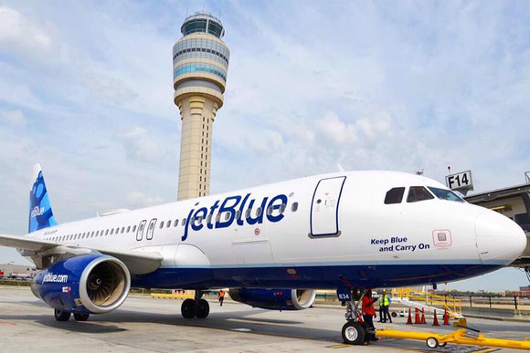 A JetBlue airplane on the ground.