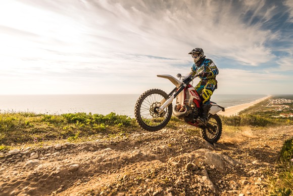 Enduro motorcycle rider on a dirt track.
