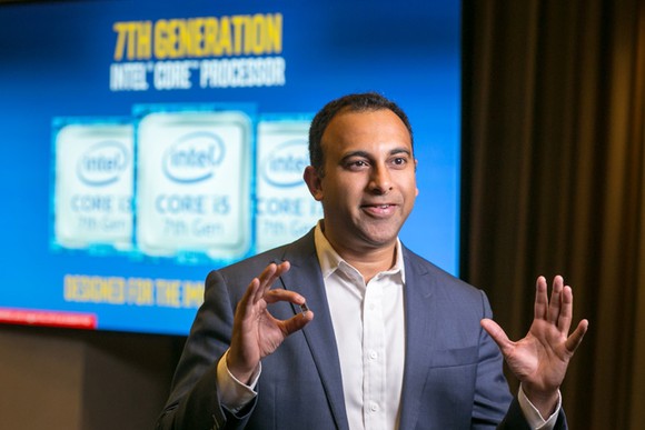 Intel executive Navin Shenoy holding a seventh-generation Core processor.