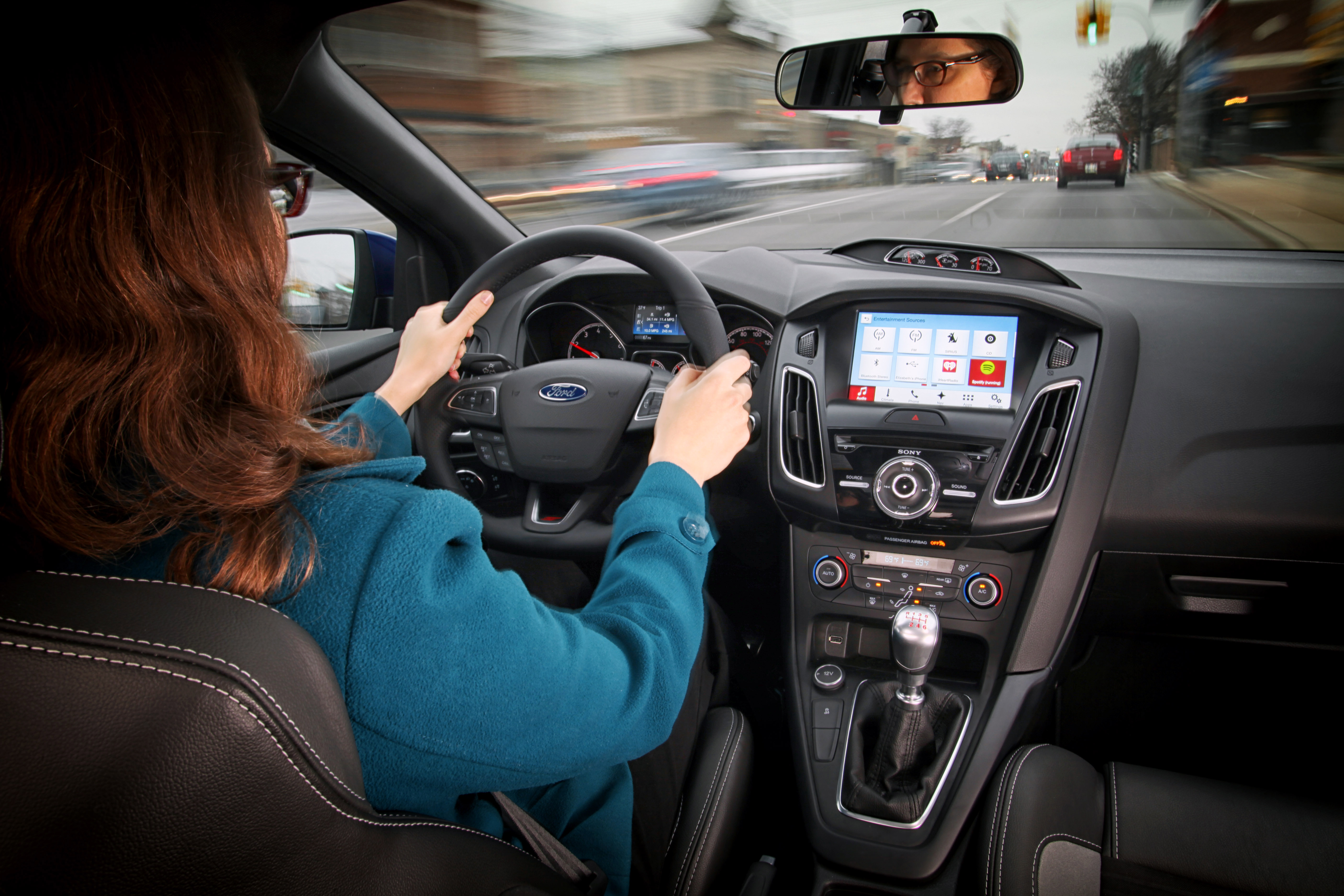 The dashboard of a Ford vehicle with the SYNC 3 touchscreen visible.