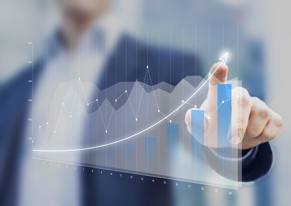 Man pointing to chart going up