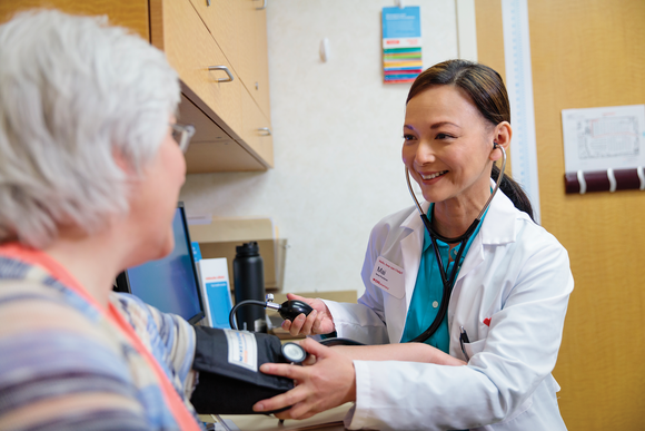 Healthcare practitioner treating a patient at CVS MinuteClinic
