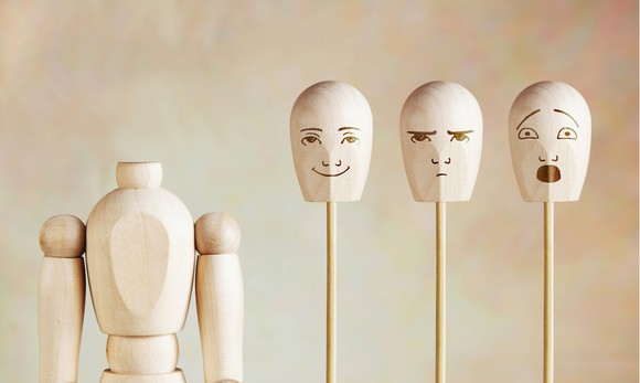 A mannequin showing many different emotions