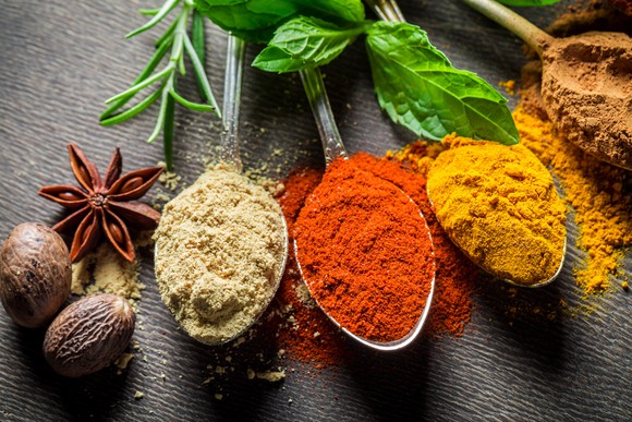 Spoons filled with spices