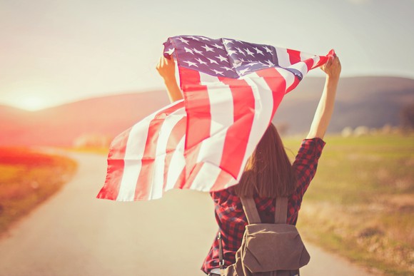 Young woman holding an American flag