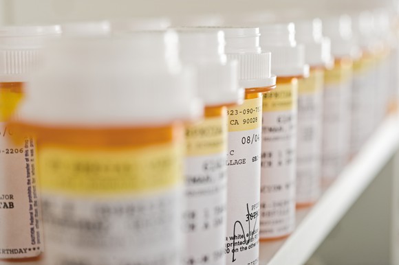 Prescription medicine bottles lined up in a row