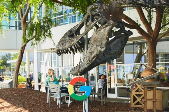 One of Google's logos hangs from the T-Rex statue at the company's corporate HQ.