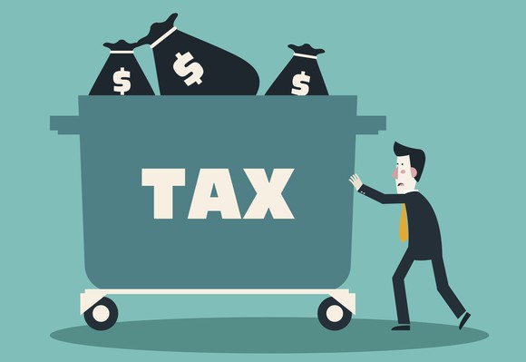 Man pushing cart full of tax dollars