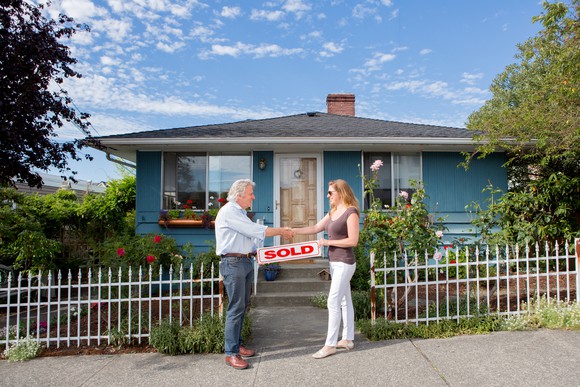 Buyer and seller shaking hands.
