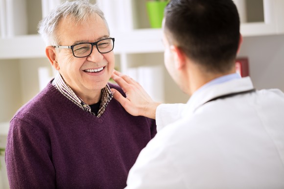 Doctor with older patient