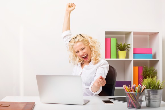 Happy woman in office
