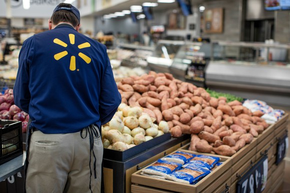 A Wal-Mart worker in the produce section