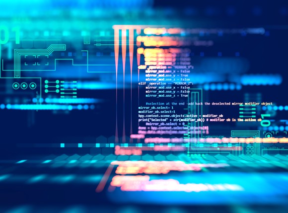 Computer code overlaying computer circuits.