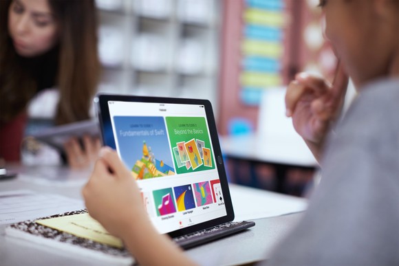 A person using an Apple iPad.