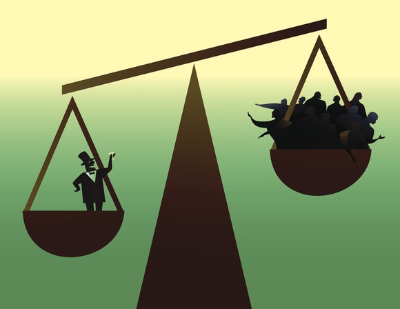 Rich man and poor people at opposite ends of scale