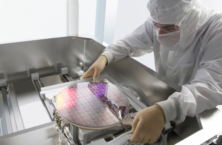 Man working on semiconductor equipment.