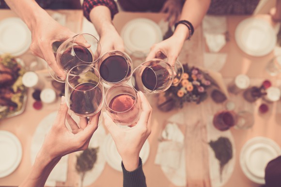 People toasting with wine and liquor