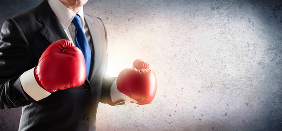 Businessman with boxing gloves on