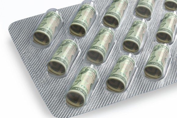dollars in pill box