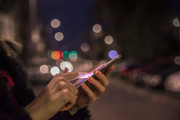 Woman using mobile phone.