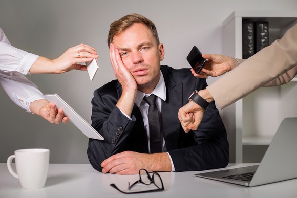 An exhausted and stressed employee.