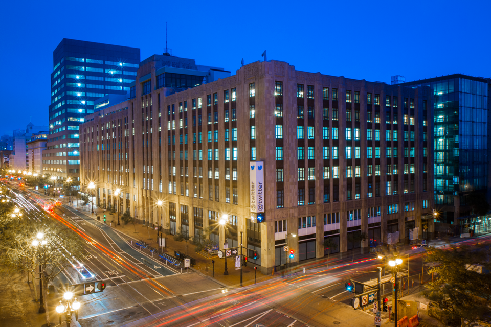 Twitter's headquarters in a time lapse photo at night.