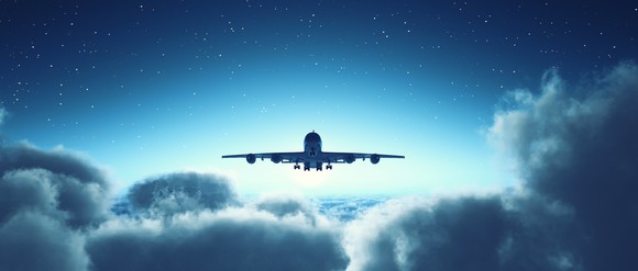 An airplane flying above the clouds.
