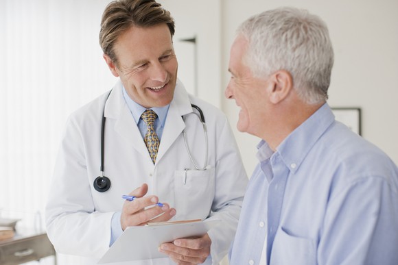 Doctor speaking with older patient.