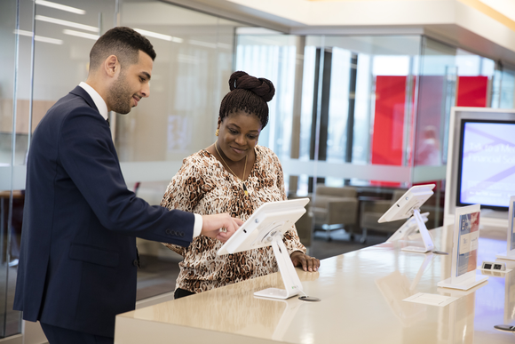 A banker helping a customer.