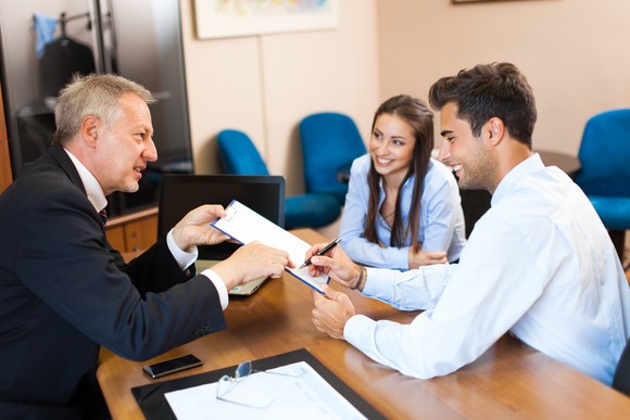 Young couple refinancing a mortgage