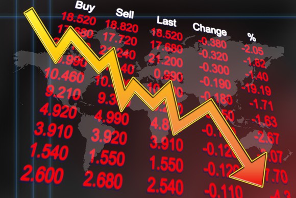 Stock board with red numbers and downward arrow.