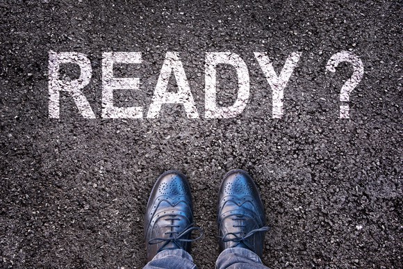 Two shoes standing in front of the word "ready" with a question mark.