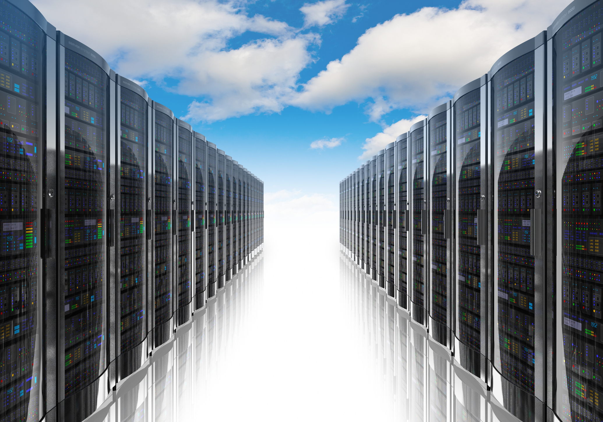 Rows of server systems, under a blue sky and several clouds.