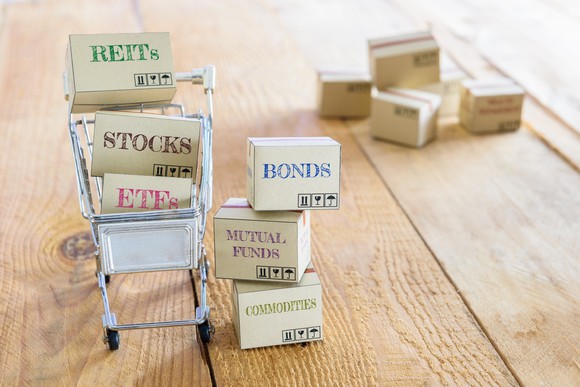 Shopping cart full of different investments.