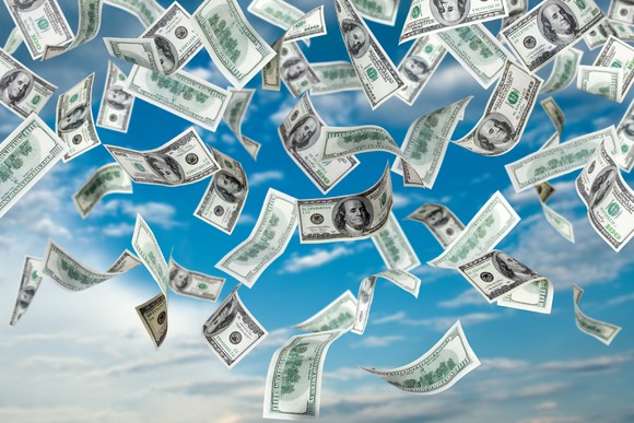 Hundred-dollar bills falling from the sky.