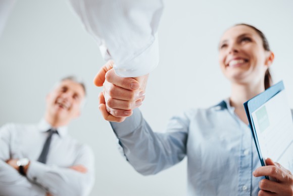 Candidate shaking hands with interviewer.