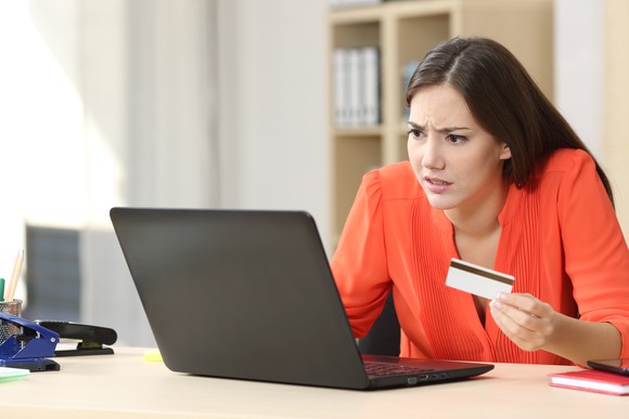 Woman having trouble online with credit card