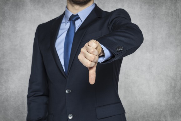 A man giving the thumbs-down sign.