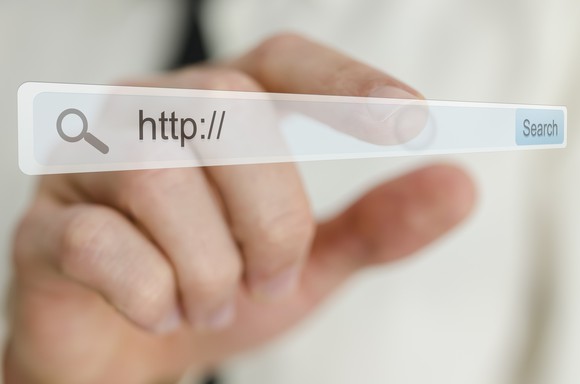 A finger reaches out to touch a virtual search bar.