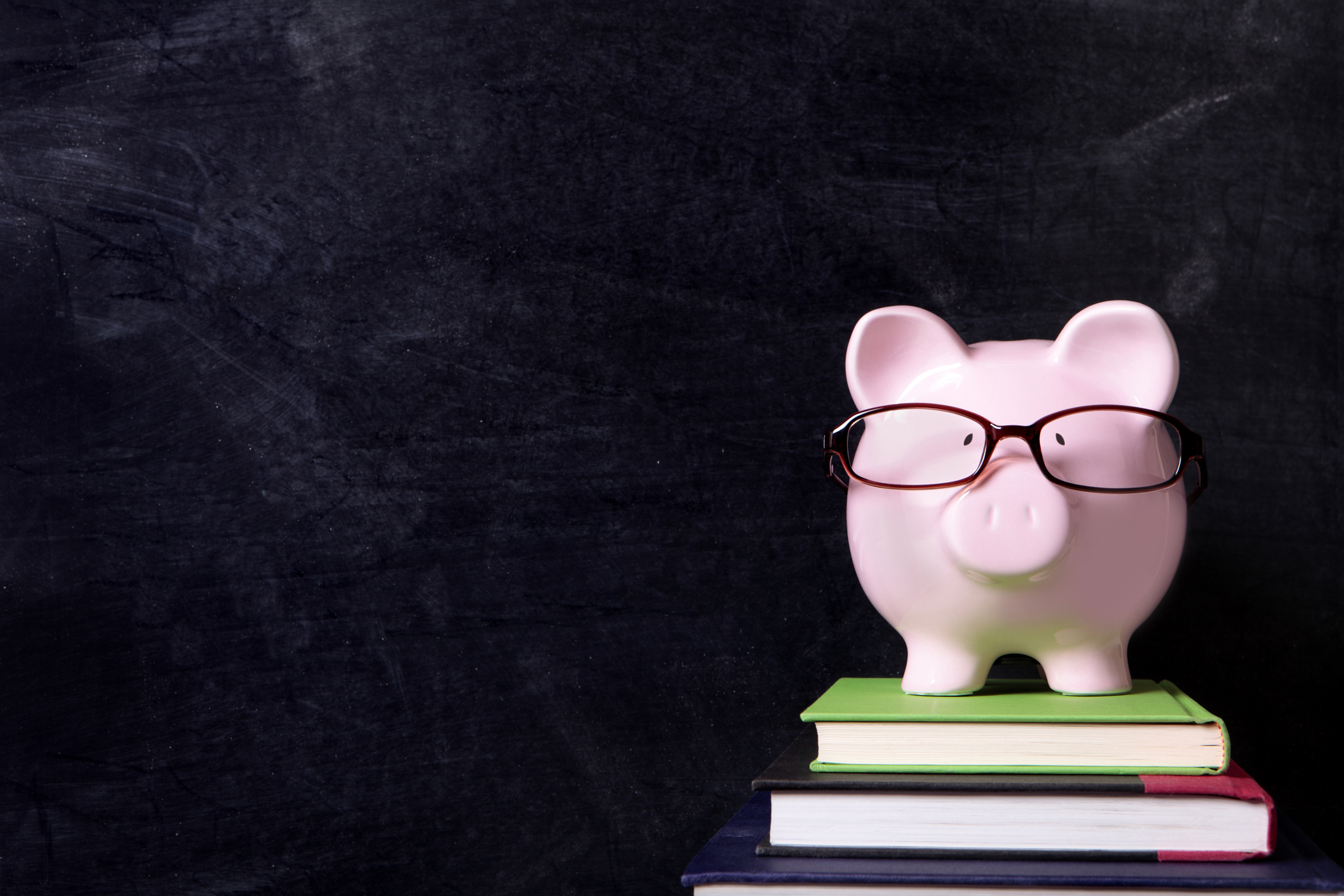 A piggy bank with glasses on.