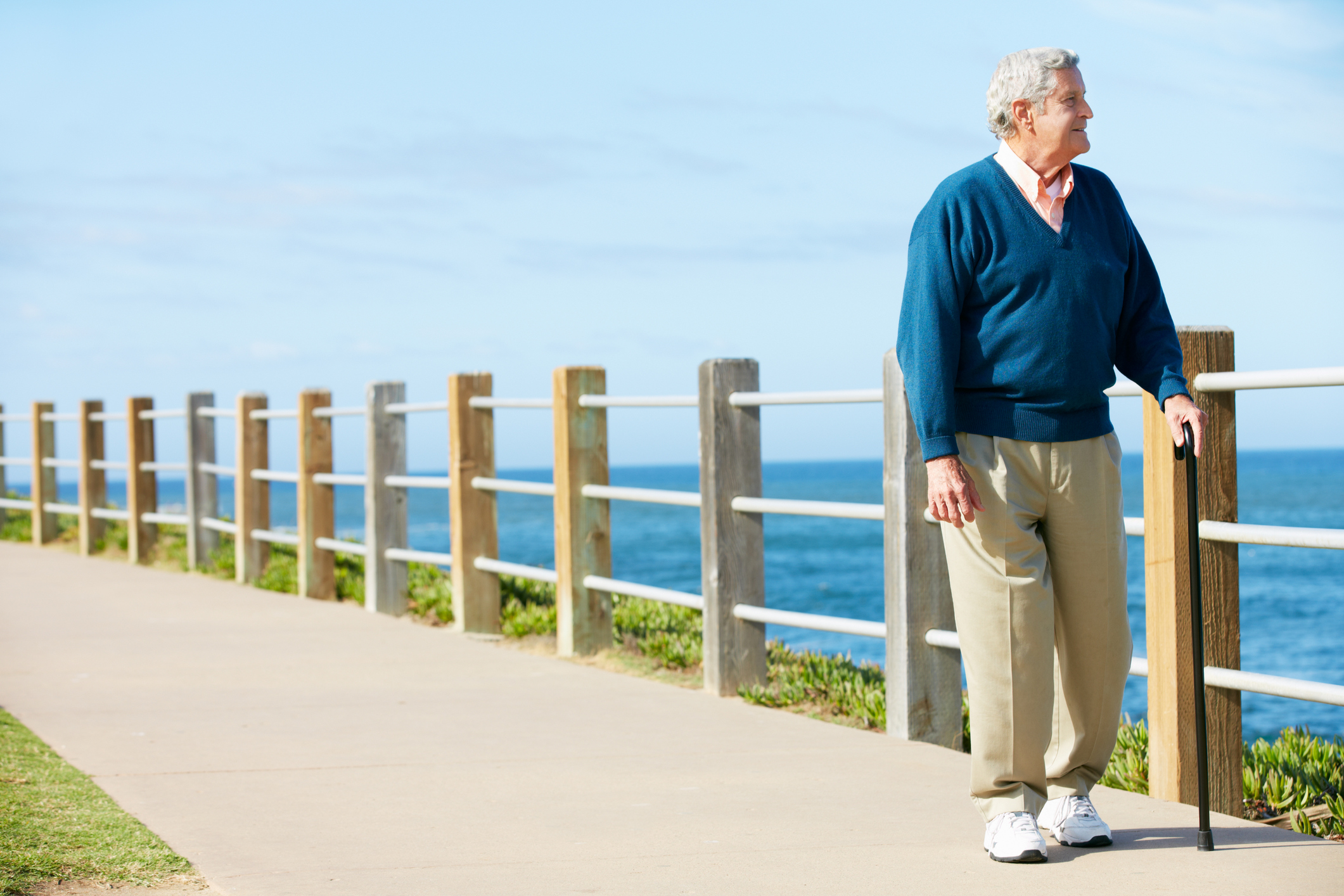 Senior man walking by the water