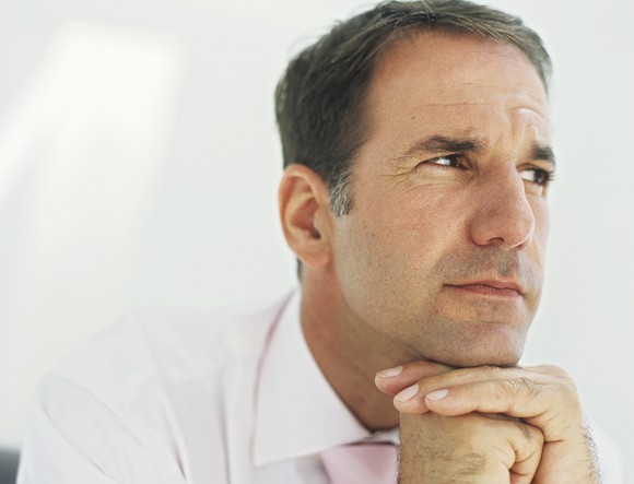 Man thinking with chin on fist