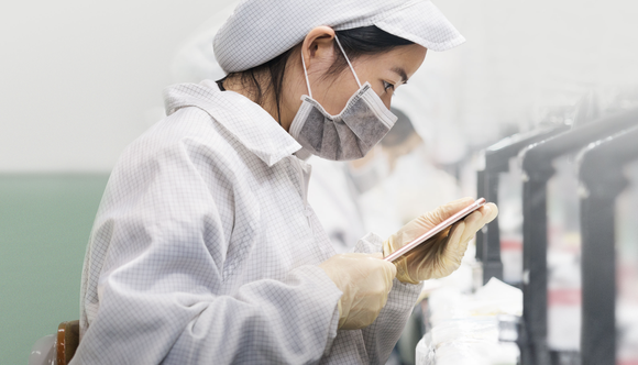 Worker examining an iPhone